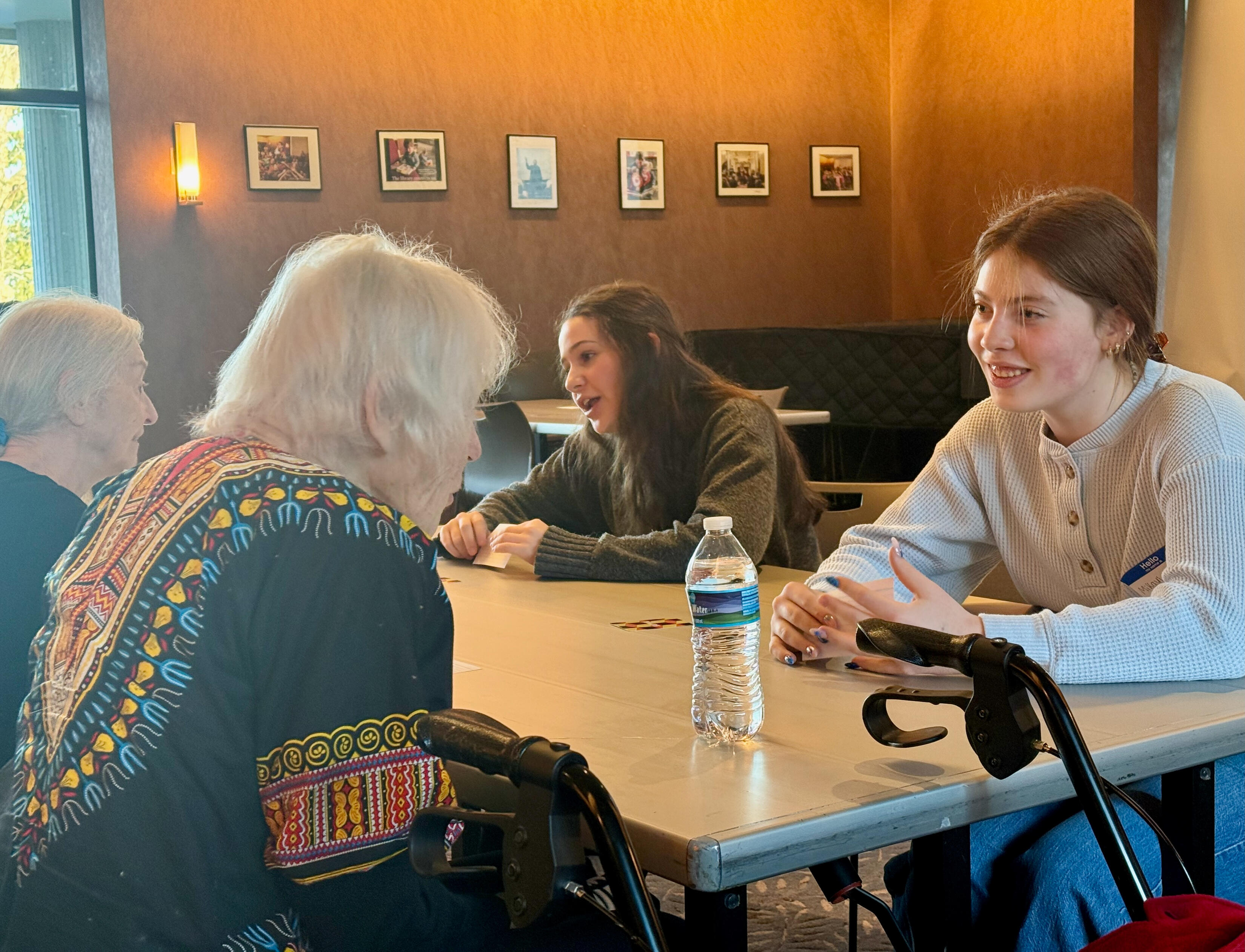 Nyack students and lifelong learners sharing stories during a Timeless Treasures icebreaker session.
